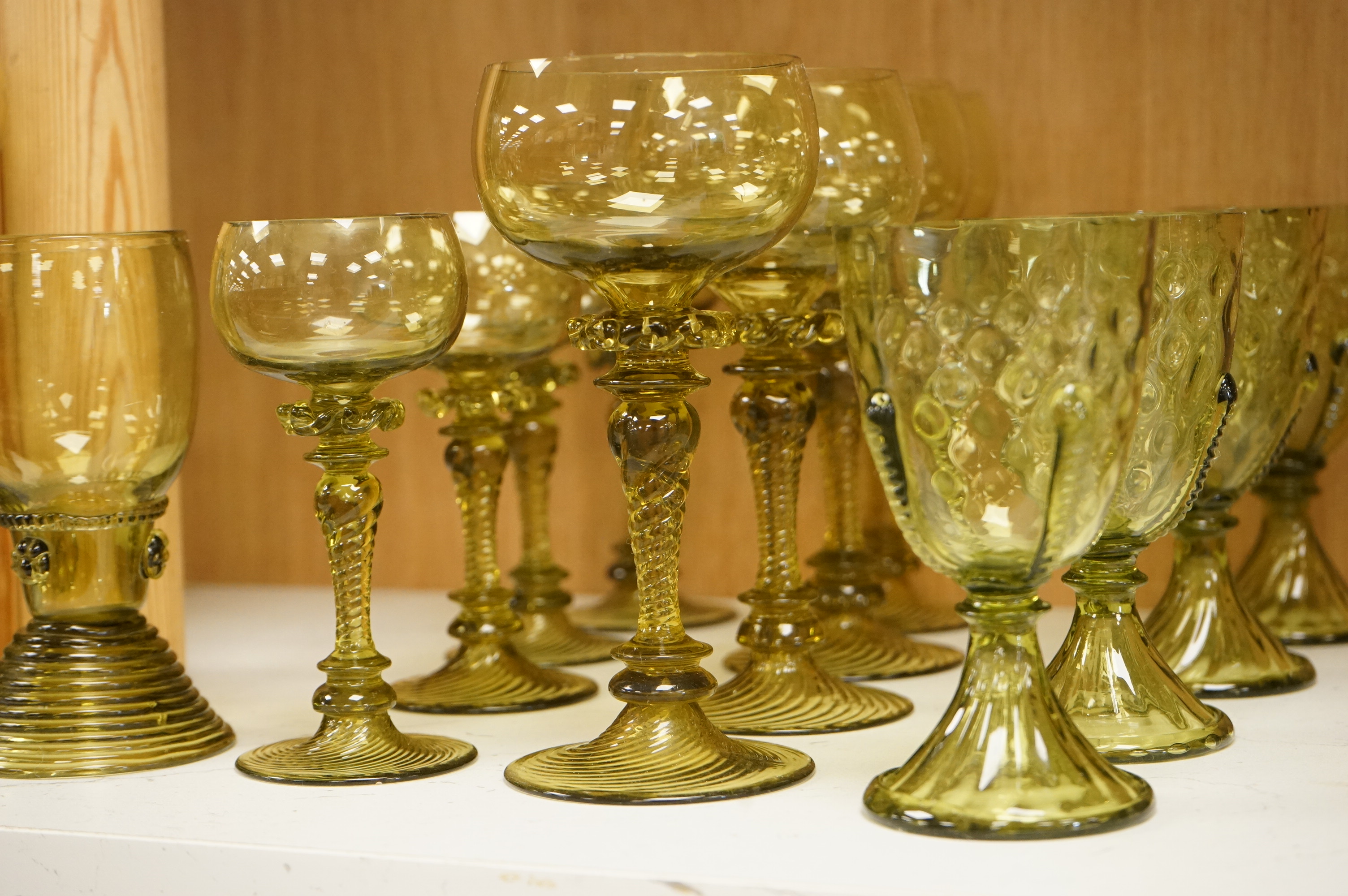 A collection of Continental green glassware to including hock glasses and tumblers, largest 17cm high